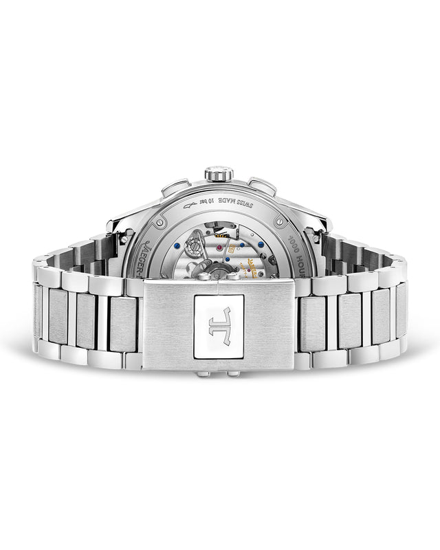 A close-up of the Jaeger-LeCoultre Polaris Chronograph’s back reveals its mechanical movement through a transparent case back, while the steel bracelet features a clasp engraved with the letter H.